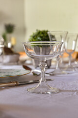 table set with crystal glasses, table set in the restaurant, table set for dinner, glass of champagne, table set, glass of champagne on the table, close up of crystal glass