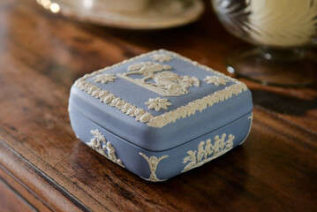 wedding rings in a box, jewelry box on a wooden background, blue box, blue antique porcelain box,...