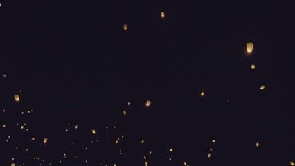Light lanterns fill the night sky