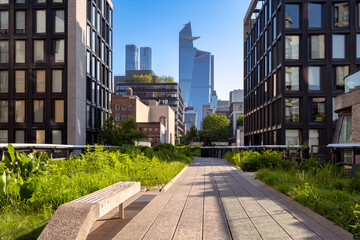 The High Line promenade with Hudson Yards skyscrapers. Elevated greenway park in Chelsea, Manhattan, New York City