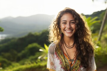 Smiling attractive hispanic young woman looking at the camera in the city. - Powered by Adobe