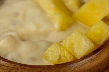 pineapple yogurt with slices of ripe yellow pineapple pineapples with fresh yogurt