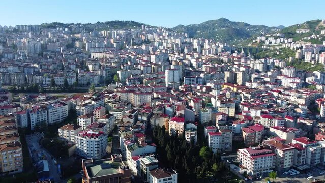 Aerial panorama of Trabzon, Turkey, revealing the densely built metropolis from a top view. The dynamic cityscape, capturing the bustling urban life of this vibrant Turkish city.