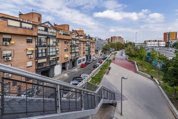 Metal walkway in an urban park on the side of a ring road