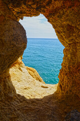 
Ocean view through an opening in the rocky cliff