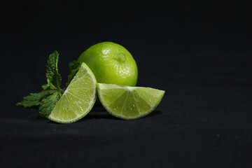 Fresh Green lemon with mint leaves