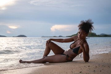Beautiful Woman in Bikini Enjoying life on Tropical beach. Female on Sandy Beach Relaxing. Summer Vacation time.