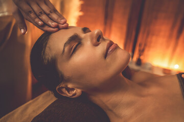Closeup caucasian woman enjoying relaxing anti-stress head massage and pampering facial beauty skin...