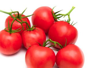 Tomatoes close up view. Fresh ripe tomatoes isolated on white background.