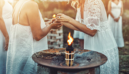 essential oil in a woman hand, ceremony space. - obrazy, fototapety, plakaty