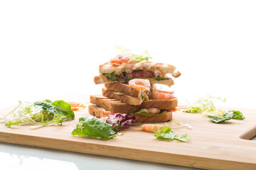 sandwich with lettuce and shrimp.