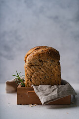 Fresh Sliced Homemade Wholegrain Wheat Bread whit olive oil on white rustic background. Artisan Sourdough