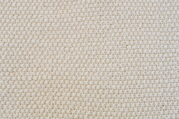 Purl Stitch in Cream Colored Yarn as Background