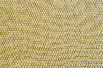 Purl Stitch in Gold Yarn as Background