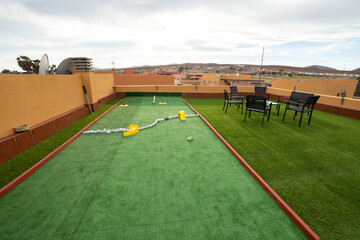 Miniature golf course on the rooftop of a villa  - obrazy, fototapety, plakaty