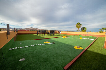 Miniature golf course on the rooftop of a villa 