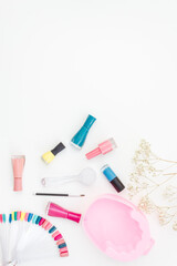 Bright gel varnishes with manicure and pedicure beauty tools, top view