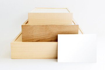 Wooden presentation boxes of various sizes and blank greeting card