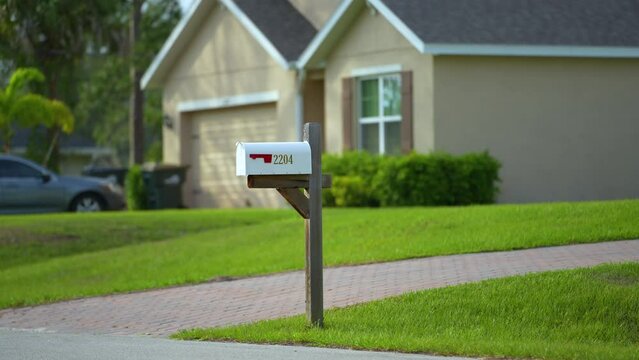 Typical american outdoors mail box on suburban street side