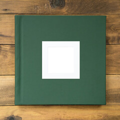 Photo album with green leather hardcover and frame for design and personalization