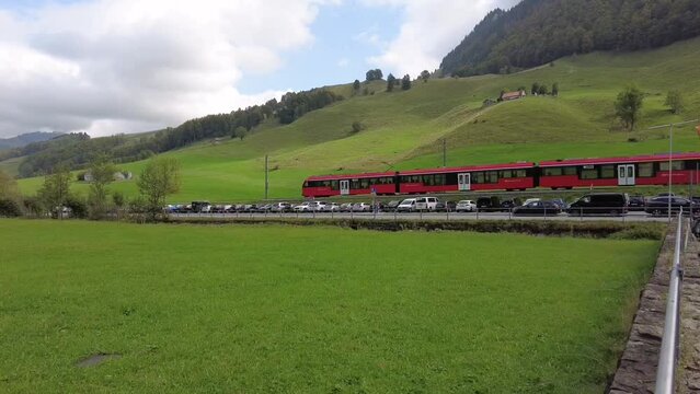 Wassernauen, Switzerland - 30. September 2023: The red train of Appenzell is approaching Wassernauen - a popular outdoor activitiy paradise.