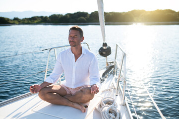 Man sitting in a lotus pose and meditating