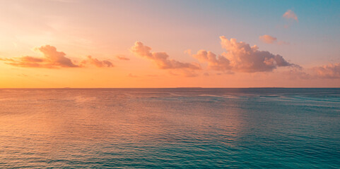 Fototapeta na wymiar Aerial panoramic view of sunset over ocean. Colorful sky clouds water. Beautiful serene scene, wide angle seascape. Drone view, majestic stunning nature background. Best sea sky sunrise. Inspire views