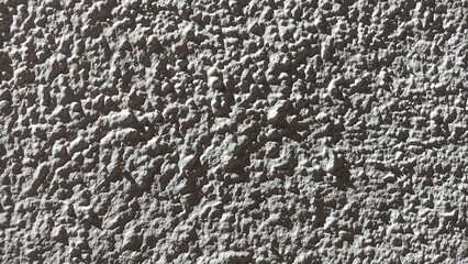 The facade of the house in Portugal is made of cement plaster, painted beige