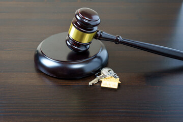 House keys and judge gavel. Concept purchase sale, rent, auction, mortgage. The arrest of property, the imposition of restrictions. Real estate and law concept