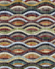 Wavy line mosaic flooring with small multicolored square tiles in blue, green, and brown. Abstract waves. Seamless geometric pattern. Great as a background or texture.