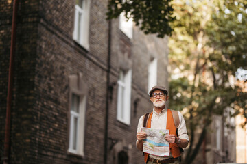 Fototapeta premium Senior tourist exploring a new city, exploring interesting places