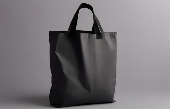 Generative AI Craft, Stylish Empty Black Tote Bag Mockup Against a Subtle Grey Backdrop