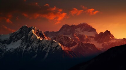 Free Photo of A breathtaking mountain landscape at sunset with snow-capped peaks, a fiery sky.