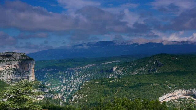 Timelapse of clouds moving over mountain landscape, Gorges de la Nesque, Vaucluse in Provence, southern France. View from viewpoint Belvedere de Saint Hubert.