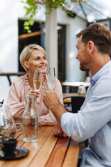 Portrait of beautiful couple in a restaurant, on a romantic date.