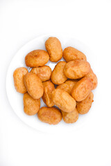 Sausages in dough on a white plate. Delicious meat appetizer in batter.