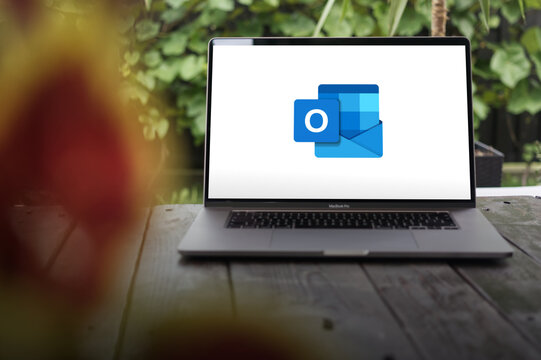 Microsoft Outlook logo, a personal information manager software system from Microsoft, available as a part of the Microsoft 365, displayed on a MacBook Pro screen