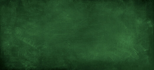 Fototapeta na wymiar Chalk rubbed out on green chalkboard background
