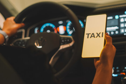 October 2, 2023, Brazil. In this photo illustration, the Taxi logo is displayed on a smartphone screen.