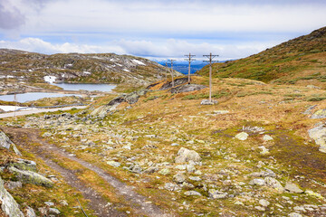 Power line voltage tower in mountains