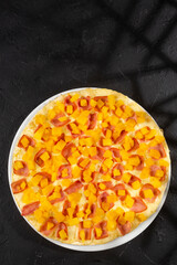 Delicious Hawaiian pizza with pineapple, ham and mozzarella