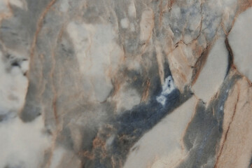 Beige marble background. Blue textured lines on marble background. Flat lay. Top view.Copy space.