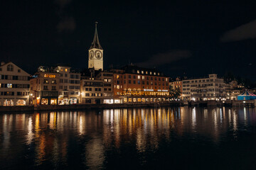 Fototapeta na wymiar View of historic Zurich city center with famous Fraumunster Church and river Limmat at Lake Zurich , in twilight, Canton of Zurich, Switzerland.