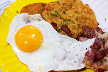Egg bowl with potato pancakes on plate