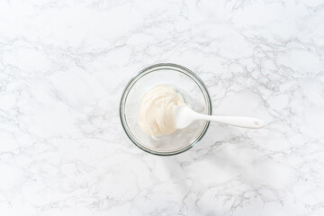 Homemade royal icing for decorating heart-shaped sugar cookies