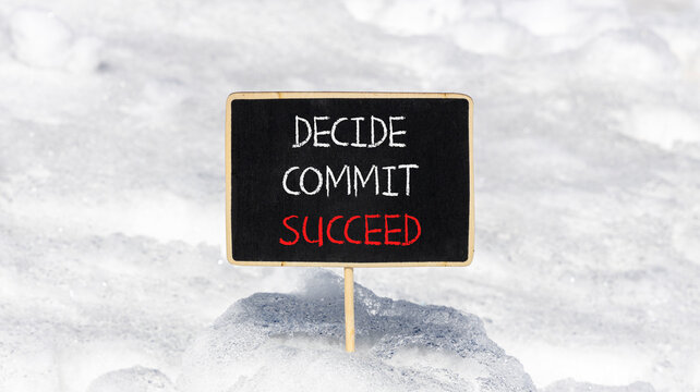 Decide commit succeed symbol. Concept word Decide Commit Succeed on beautiful black chalk blackboard. White snow. Beautiful white snow background. Business decide commit succeed concept. Copy space.