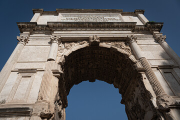 Obraz premium Arch of Titus in the Via Sacra near the Roman Forum in Rome, Italy. Monument made of stone