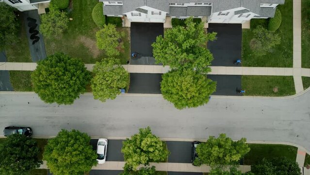 Aerial top view of Driveway sealcoating pavement, Near private houses in the suburbs