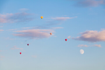Flying hot air balloons in the evening sky