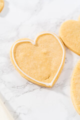 Heart-shaped sugar cookies with royal icing